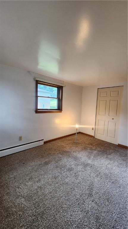 1008 Wallace St, Vandergrift Wml, PA 15690 - carpeted spare room with baseboard heating and baseboards