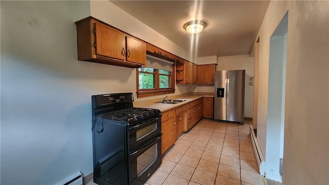 1008 Wallace St, Vandergrift Wml, PA 15690 - kitchen featuring double oven range, stainless steel fridge, light countertops, light tile patterned floors, and a baseboard heating unit