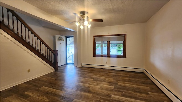 1008 Wallace St, Vandergrift Wml, PA 15690 - entrance foyer featuring a textured ceiling, ceiling fan, stairs, wood finished floors, and a baseboard heating unit