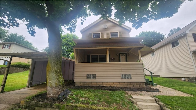 1008 Wallace St, Vandergrift Wml, PA 15690 - view of front facade featuring a front lawn and covered porch