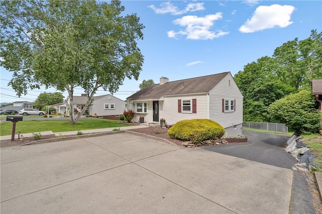 1072 Aetna Dr, Wayne Twp Law, PA 16117 - view of front facade with a chimney, a front yard, and driveway