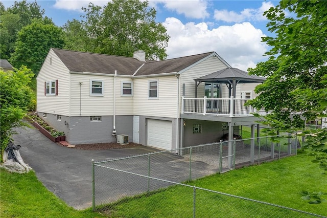 1072 Aetna Dr, Wayne Twp Law, PA 16117 - rear view of house with asphalt driveway, a chimney, an attached garage, a gazebo, and a shingled roof