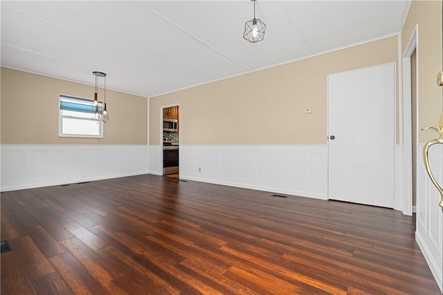1072 Aetna Dr, Wayne Twp Law, PA 16117 - spare room with wainscoting and dark wood-type flooring