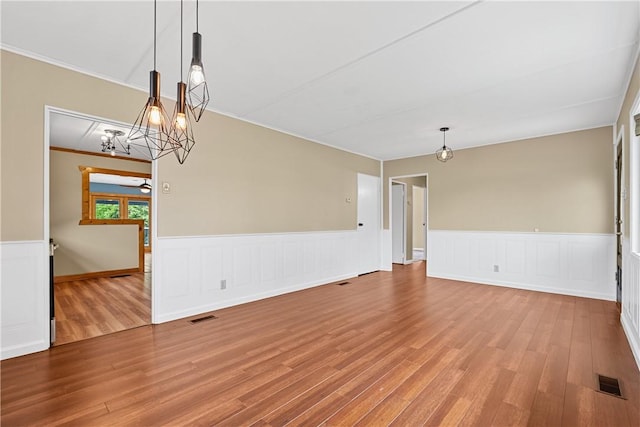 1072 Aetna Dr, Wayne Twp Law, PA 16117 - spare room with a wainscoted wall, wood finished floors, ornamental molding, and a chandelier