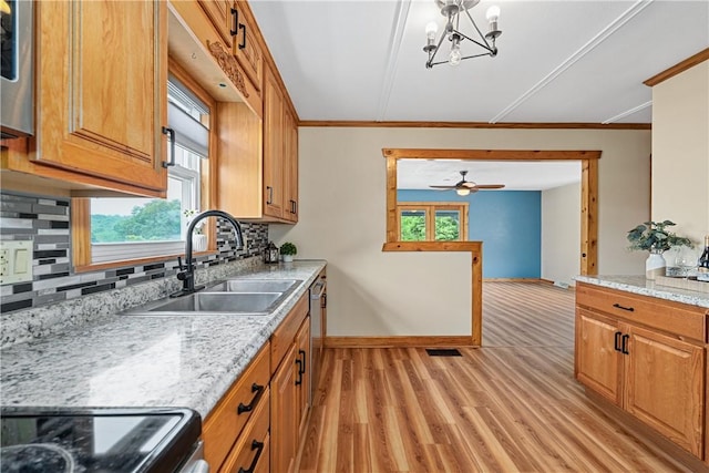 1072 Aetna Dr, Wayne Twp Law, PA 16117 - kitchen featuring light wood-style floors, decorative backsplash, range, brown cabinetry, and ceiling fan
