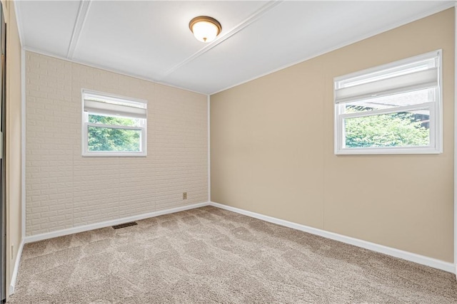 1072 Aetna Dr, Wayne Twp Law, PA 16117 - spare room featuring brick wall, carpet flooring, and crown molding