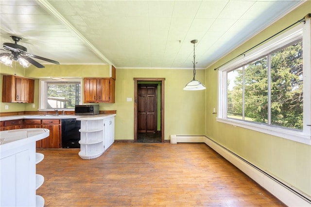 4177 Main St, Cook Twp, PA 15687 - kitchen featuring brown cabinets, dishwasher, baseboard heating, stainless steel microwave, and wood finished floors
