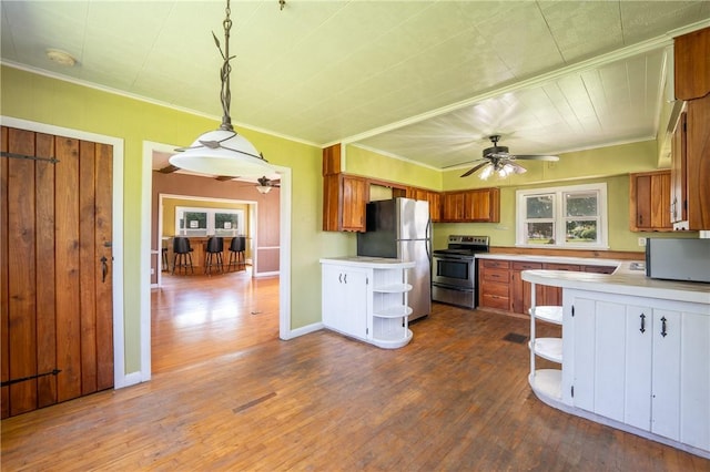 4177 Main St, Cook Twp, PA 15687 - kitchen with appliances with stainless steel finishes, open shelves, ceiling fan, light countertops, and ornamental molding
