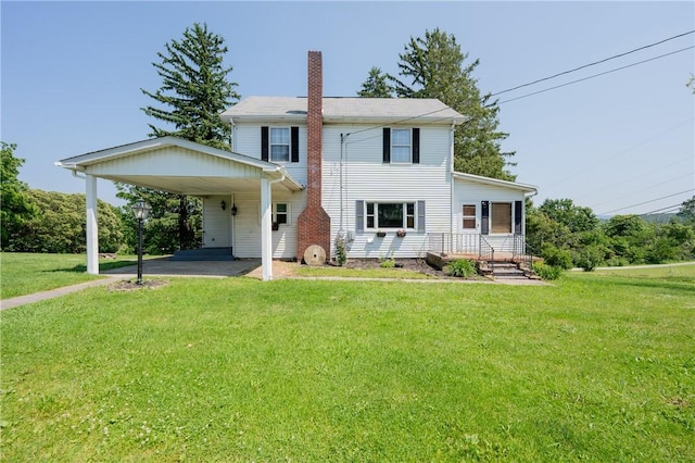 4177 Main St, Cook Twp, PA 15687 - back of house with a carport, a chimney, a yard, and driveway