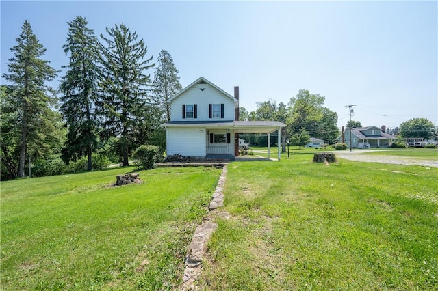4177 Main St, Cook Twp, PA 15687 - view of front of property with a porch, a carport, a front yard, and a chimney