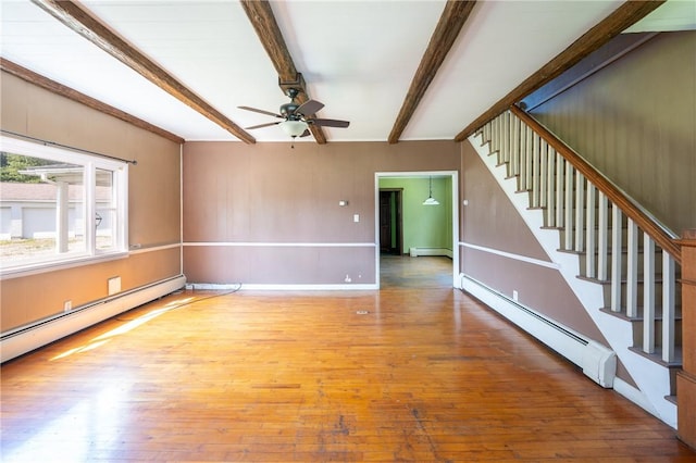 4177 Main St, Cook Twp, PA 15687 - unfurnished living room featuring a baseboard heating unit, beam ceiling, baseboard heating, hardwood / wood-style floors, and ceiling fan