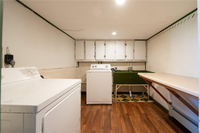 4177 Main St, Cook Twp, PA 15687 - laundry area with cabinet space, separate washer and dryer, baseboard heating, and dark wood finished floors