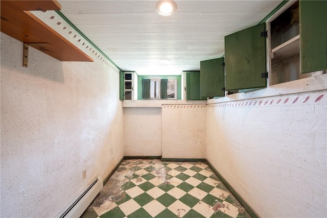 4177 Main St, Cook Twp, PA 15687 - below grade area with tile patterned floors and a baseboard radiator