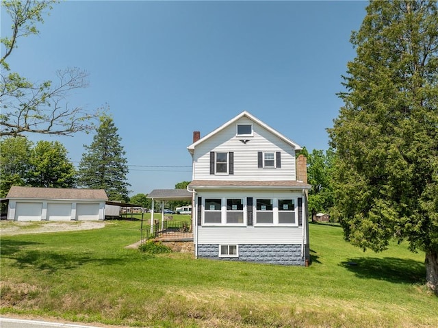 4177 Main St, Cook Twp, PA 15687 - view of side of property featuring a chimney, an outbuilding, a lawn, and a garage