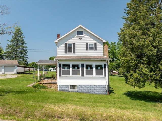 4177 Main St, Cook Twp, PA 15687 - view of property exterior featuring a chimney, a yard, and a garage
