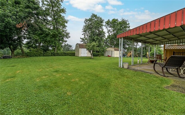 105 Hilltop Cir, Shaler, PA 15116 - view of green lawn featuring a shed and a patio area