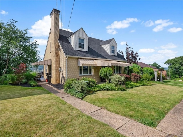 1713 Buchanan Ext, Aliquippa, PA 15001 - view of front of property with brick siding, a chimney, a front yard, and a shingled roof
