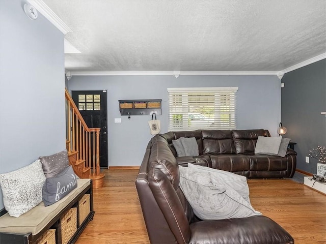1713 Buchanan Ext, Aliquippa, PA 15001 - living area with crown molding, light wood-type flooring, stairs, and a textured ceiling