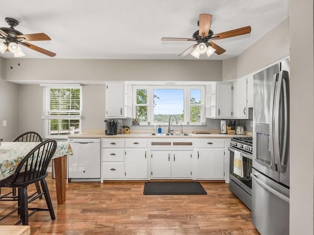 1713 Buchanan Ext, Aliquippa, PA 15001 - kitchen with appliances with stainless steel finishes, ceiling fan, light countertops, and healthy amount of natural light