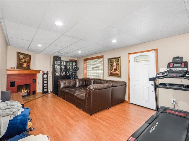 1713 Buchanan Ext, Aliquippa, PA 15001 - living room with a drop ceiling, light wood finished floors, and a brick fireplace
