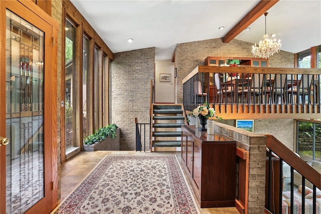 2370 Morrow Rd, Upper St Clair, PA 15241 - entryway featuring brick wall, a chandelier, and stairway