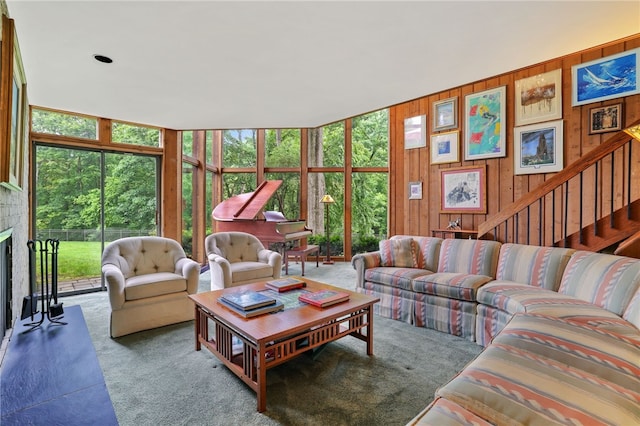 2370 Morrow Rd, Upper St Clair, PA 15241 - living area featuring carpet flooring, healthy amount of natural light, wood walls, expansive windows, and stairs
