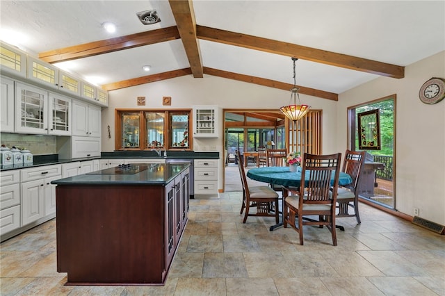 2370 Morrow Rd, Upper St Clair, PA 15241 - kitchen with dark countertops, black electric cooktop, and stone tile flooring