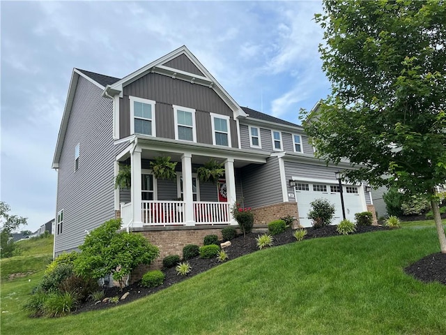 205 Regency Dr, North Strabane, PA 15330 - view of front of home featuring covered porch, a front yard, a garage, and brick siding