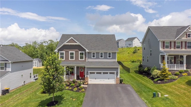 205 Regency Dr, North Strabane, PA 15330 - craftsman house with a porch, asphalt driveway, a garage, a residential view, and roof with shingles