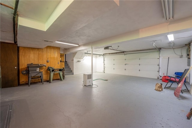 756 Arona Rd, Hempfield Twp Wml, PA 15672 - garage featuring wooden walls and a garage door opener