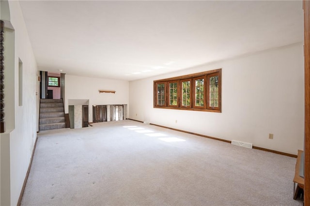 756 Arona Rd, Hempfield Twp Wml, PA 15672 - unfurnished living room featuring carpet flooring and stairway