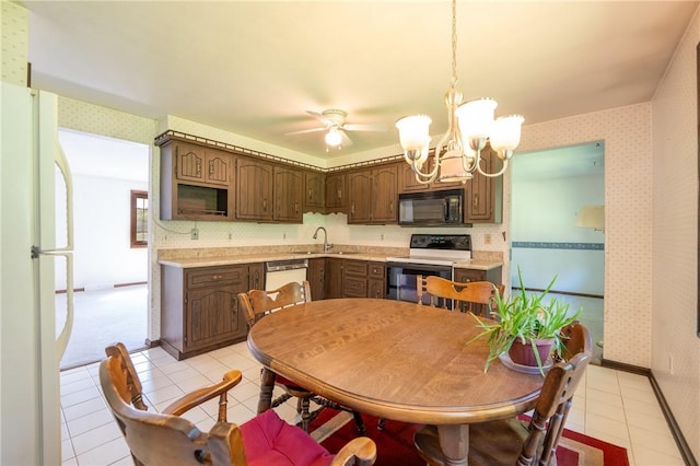 756 Arona Rd, Hempfield Twp Wml, PA 15672 - kitchen with black microwave, range with electric cooktop, freestanding refrigerator, light tile patterned floors, and wallpapered walls