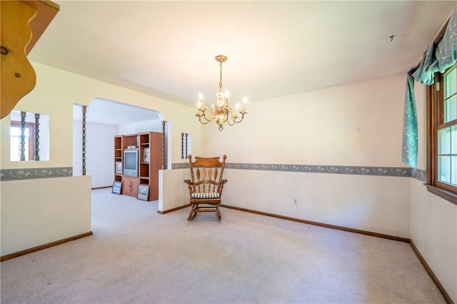 756 Arona Rd, Hempfield Twp Wml, PA 15672 - carpeted spare room featuring arched walkways and a chandelier