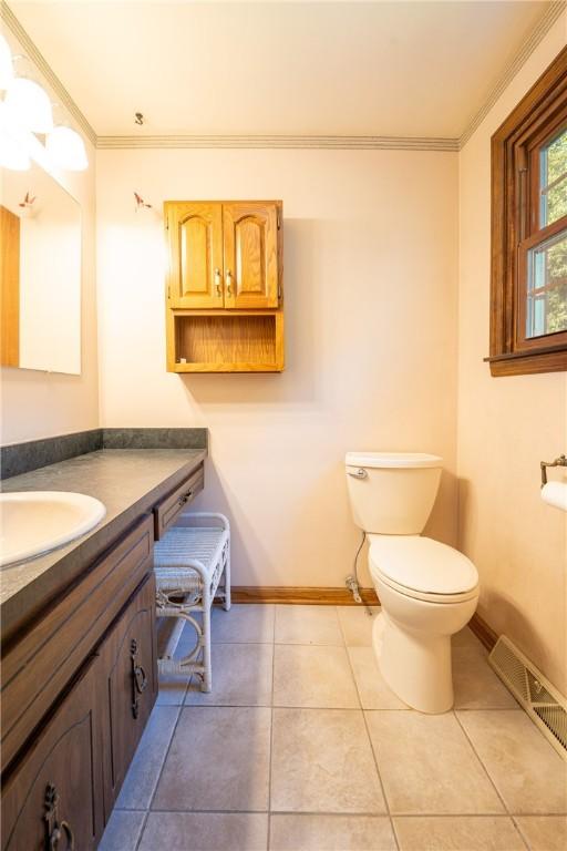756 Arona Rd, Hempfield Twp Wml, PA 15672 - half bath featuring vanity, crown molding, and tile patterned floors