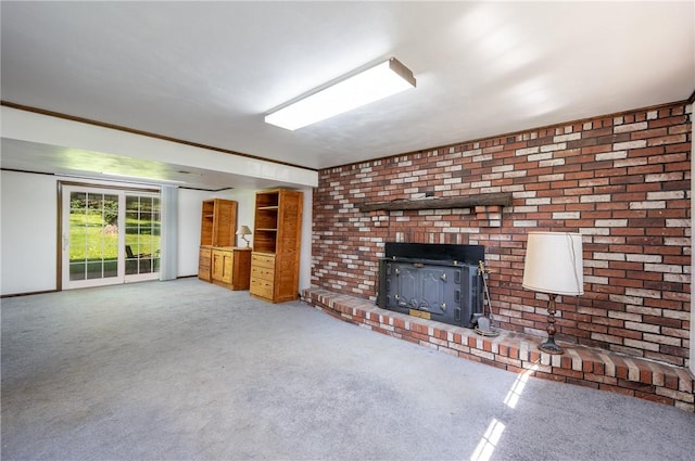 756 Arona Rd, Hempfield Twp Wml, PA 15672 - unfurnished living room featuring carpet flooring and a wood stove