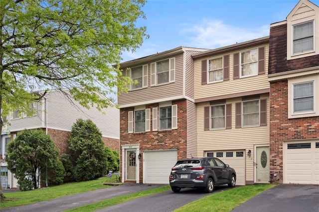 410 Redrome Cir E, South Fayette, PA 15017 - view of front of property with driveway, an attached garage, and brick siding