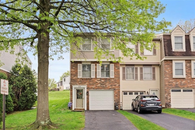 410 Redrome Cir E, South Fayette, PA 15017 - view of front of house featuring driveway, a garage, a front yard, and brick siding