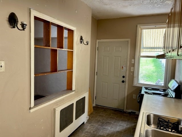 2618 Salisbury St, South Side, PA 15210 - entrance foyer featuring a textured ceiling and radiator heating unit