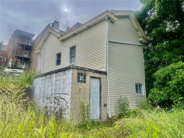 18 Windfall Way, Carrick, PA 15227 - view of home's exterior with a chimney