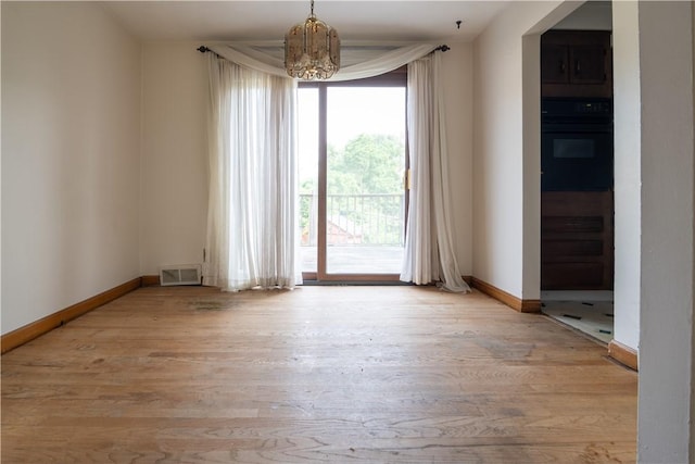 2429 Rose Garden Rd, Banksville/Westwood, PA 15220 - spare room with a chandelier and wood finished floors