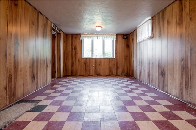 2429 Rose Garden Rd, Banksville/Westwood, PA 15220 - spare room with tile patterned floors and wood walls