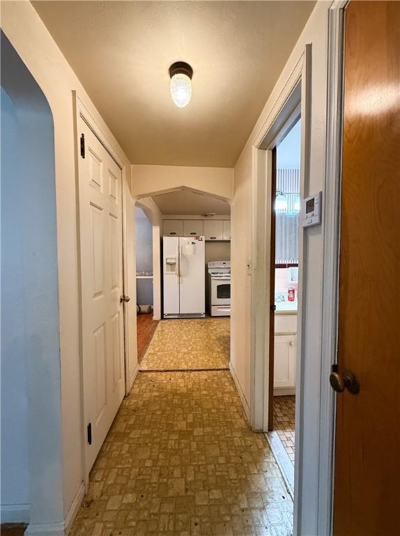 1320 Main St, Bridgeville, PA 15017 - hall with arched walkways and baseboards