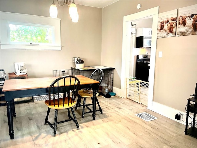 424 Hess Ave, Erie City, PA 16507 - dining space with wood finished floors and a desk
