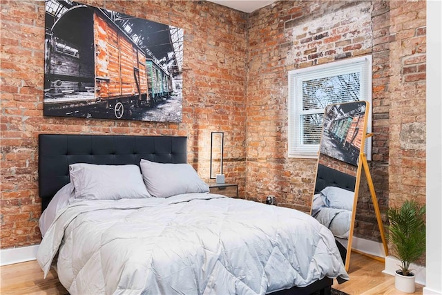 161 Morewood, Oakland, PA 15213 - bedroom with wood finished floors and brick wall