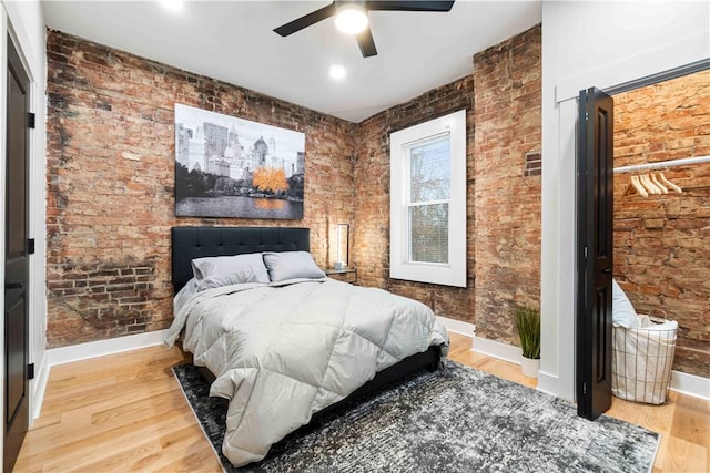 161 Morewood, Oakland, PA 15213 - bedroom featuring light wood-type flooring, a ceiling fan, and brick wall