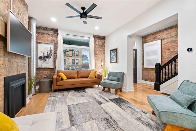 161 Morewood, Oakland, PA 15213 - living area with a ceiling fan, wood finished floors, a fireplace, and stairway