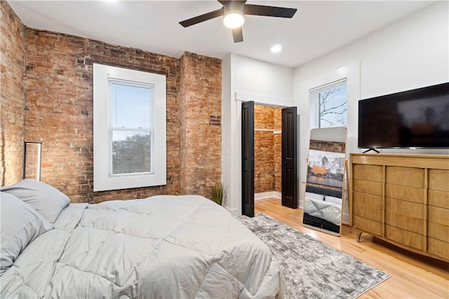 161 Morewood, Oakland, PA 15213 - bedroom with wood finished floors, brick wall, and a ceiling fan