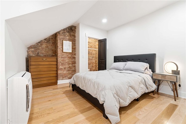 161 Morewood, Oakland, PA 15213 - bedroom featuring light wood-style floors, lofted ceiling, and brick wall