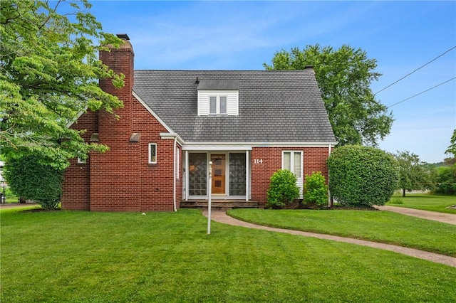 114 Pillow Ave, Cheswick, PA 15024 - view of front facade with a chimney, a front yard, and brick siding