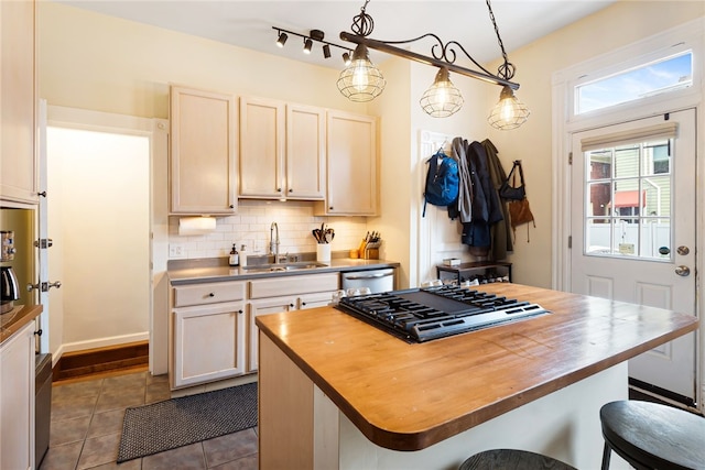 625 S Aiken Ave, Shadyside, PA 15232 - kitchen with wood counters, gas stovetop, a kitchen breakfast bar, dark tile patterned floors, and dishwasher
